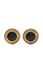Chanel black and gold clip earrings with elegant design, featuring shiny gold accents and sleek black finish.