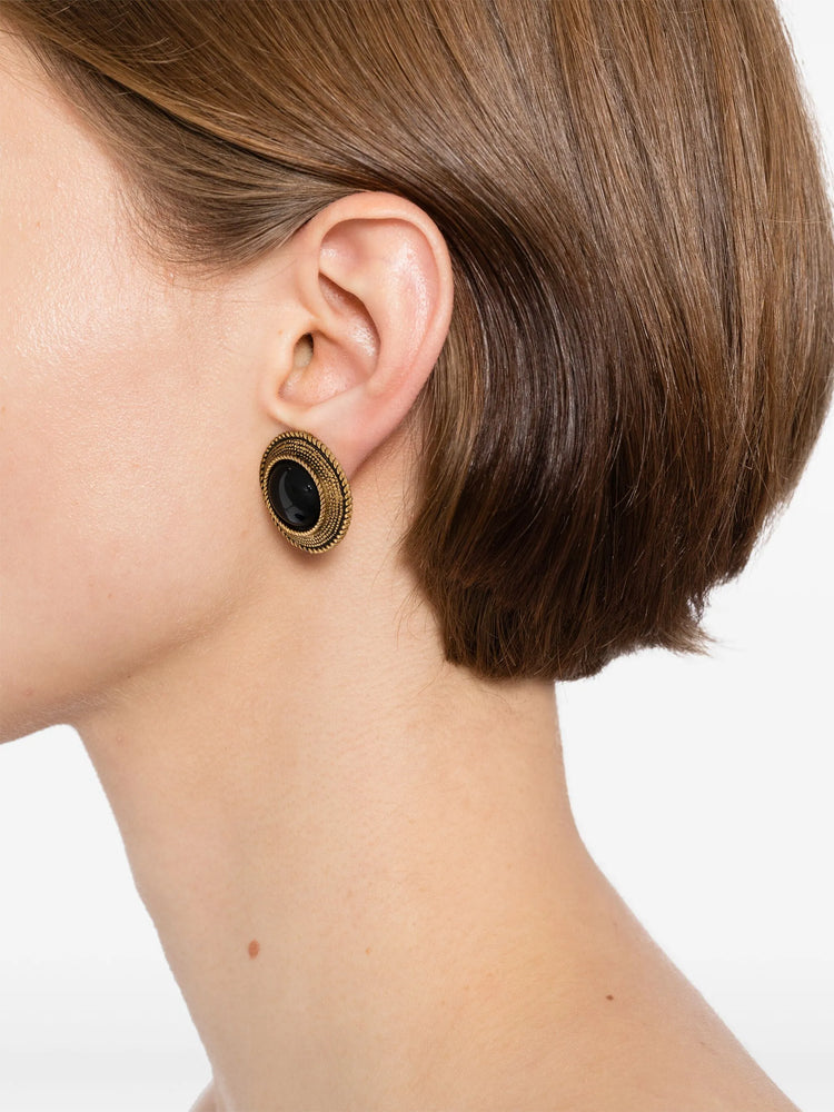 Chanel black and gold clip earrings with sleek design and shiny finish, stylish jewelry accessory.