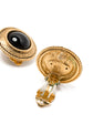 Chanel black and gold clip earrings with sleek, modern design and shiny finish, showcasing elegant jewelry style.
