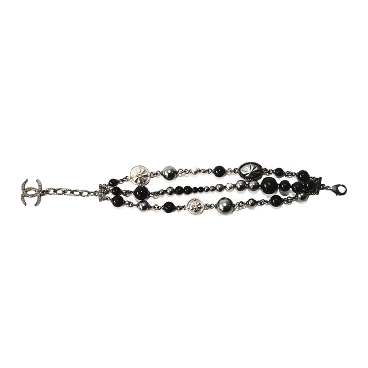Chanel CC charm beaded bracelet featuring colorful beads and signature logo charms on a delicate chain.