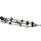 Chanel CC charm beaded bracelet featuring elegant beads and signature logo charm, stylish accessory for wrist.