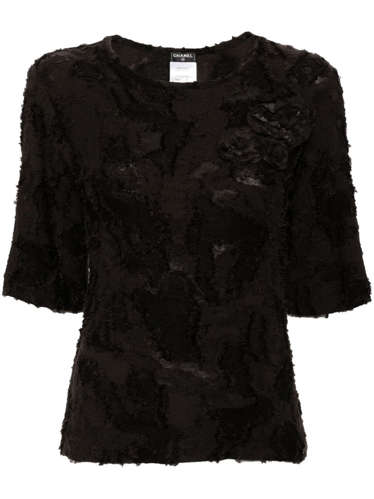 Chanel black cotton top with three brooches, front view
