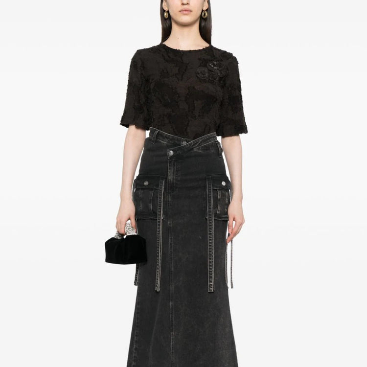 Detail of camellia appliqué on Chanel black cotton top