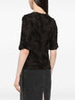 Chanel black cotton top with three brooches, back view