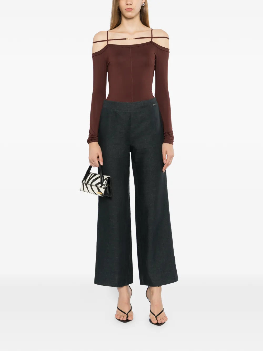 Charcoal linen wide-leg trousers by Chanel, showing relaxed fit and tailored design, with a focus on fabric texture and style details.