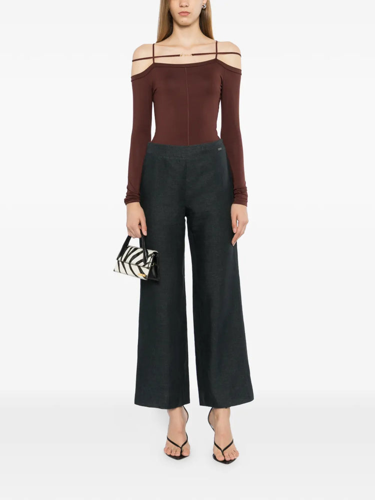 Charcoal linen wide-leg trousers by Chanel, showing relaxed fit and tailored design, with a focus on fabric texture and style details.