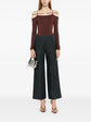Charcoal linen wide-leg trousers by Chanel, showing relaxed fit and tailored design, with a focus on fabric texture and style details.