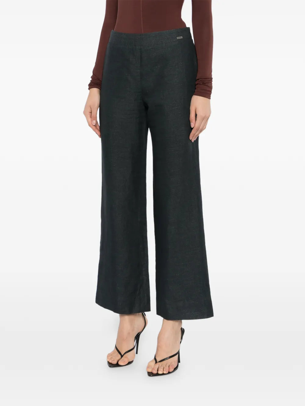 Chanel charcoal linen wide-leg trousers with a relaxed fit and high waist, shown on a model against a neutral background.
