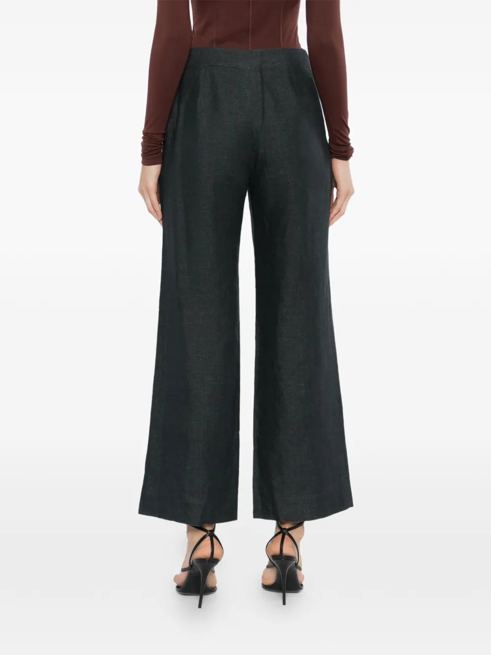 Charcoal linen wide-leg trousers by Chanel, showcasing relaxed fit and tailored design, with pleats and side pockets.