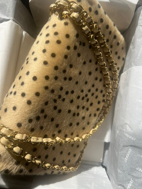 Chanel Cheetah Print Medium Flap Bag with gold hardware, stylish shoulder bag featuring animal print and elegant design.