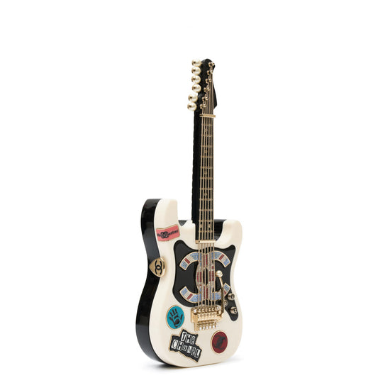 Chanel Collectible Guitar Minaudière Clutch Bag in white and black plexiglass with guitar-shaped design, CC logo detail, sticker-style motifs, pearl embellishment, gold-tone hardware, and chain shoulder strap.