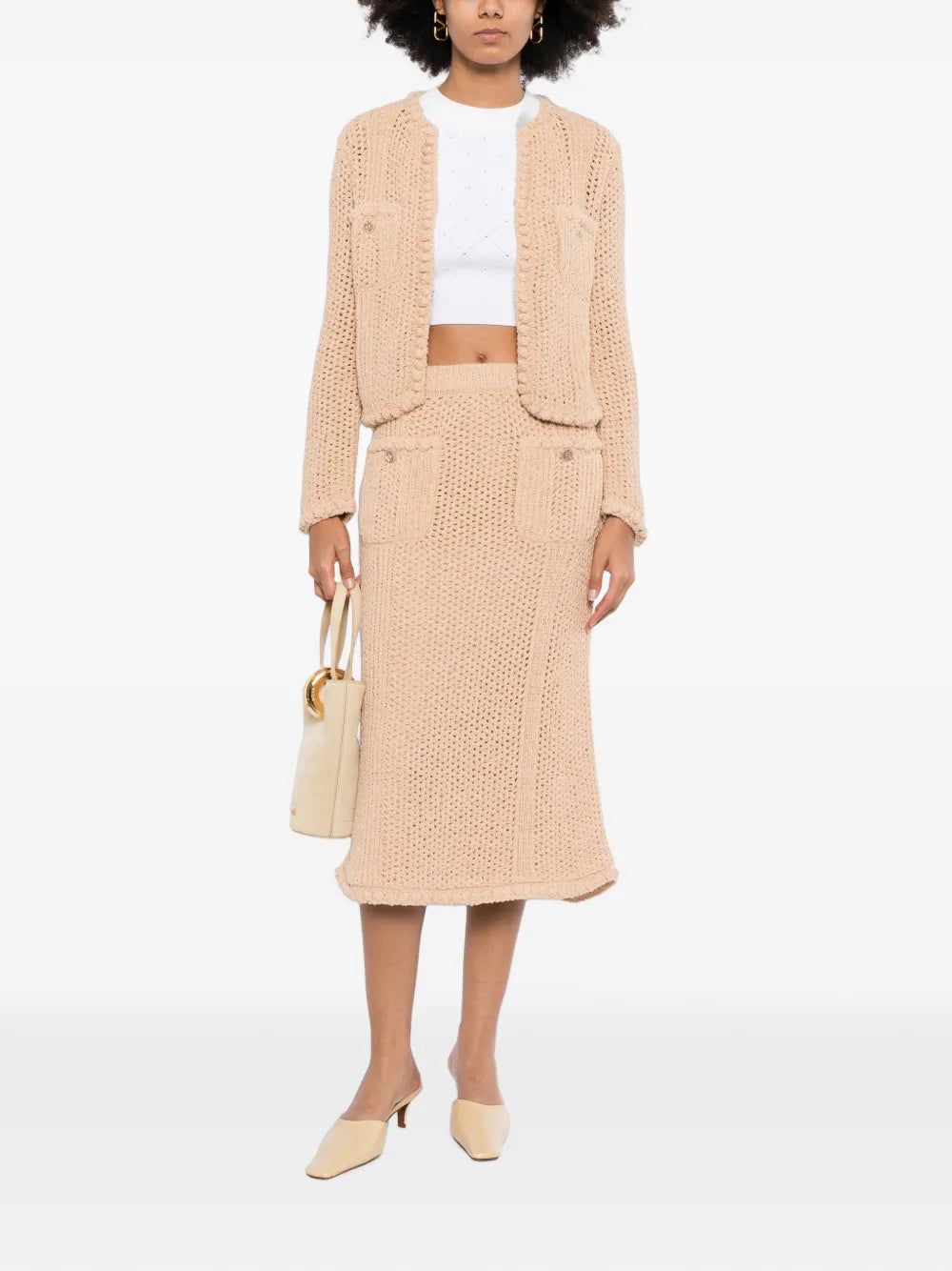 Chanel crochet knit skirt in a stylish design, featuring intricate crochet patterns and a classic, elegant silhouette.