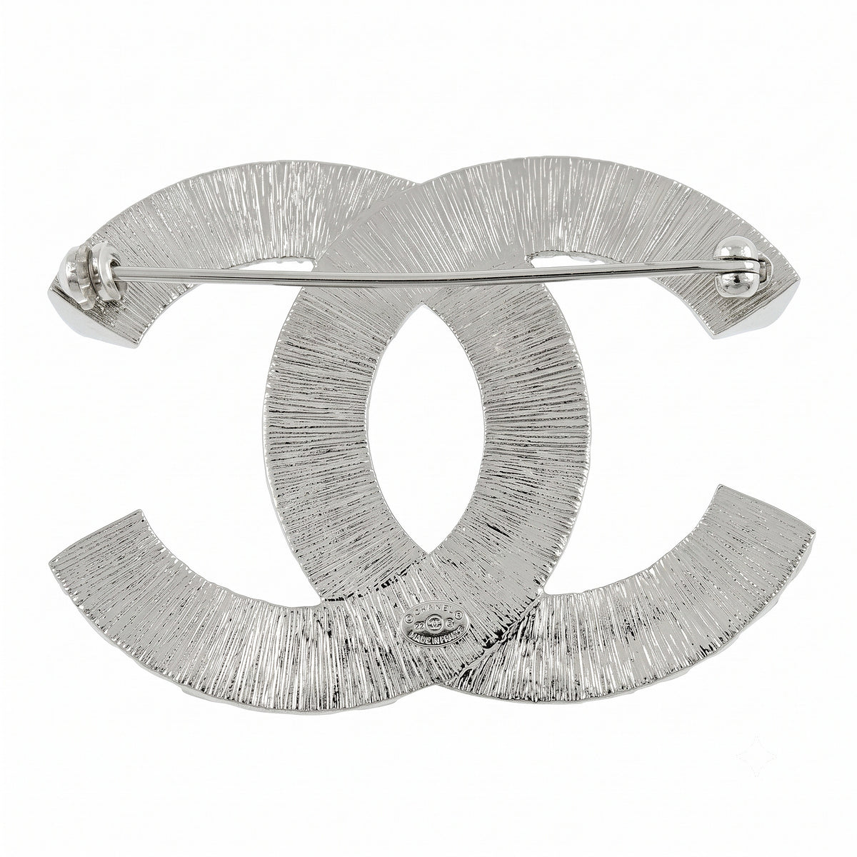 Chanel crystal pin brooch with sparkling detailing and elegant design, shown from the back with pin fastening.