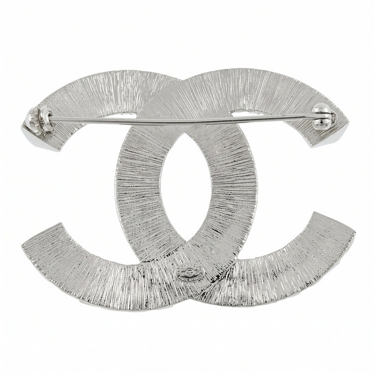 Chanel crystal pin brooch with sparkling detailing and elegant design, shown from the back with pin fastening.
