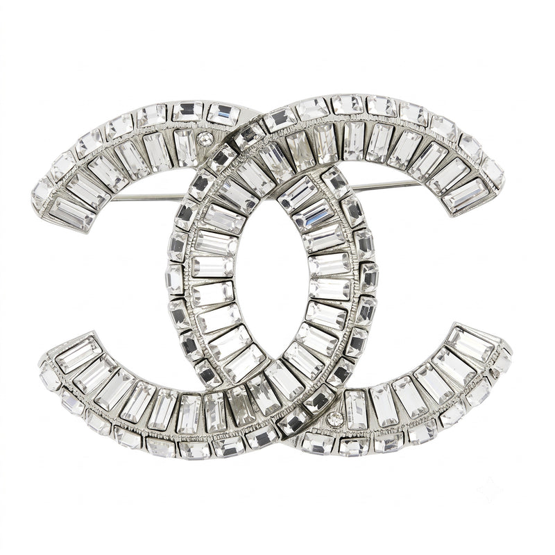 Chanel crystal pin brooch with sparkling gemstone accents and elegant design, shown from the front view.