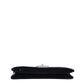 Chanel black velvet clutch shown open with diamond quilted interior