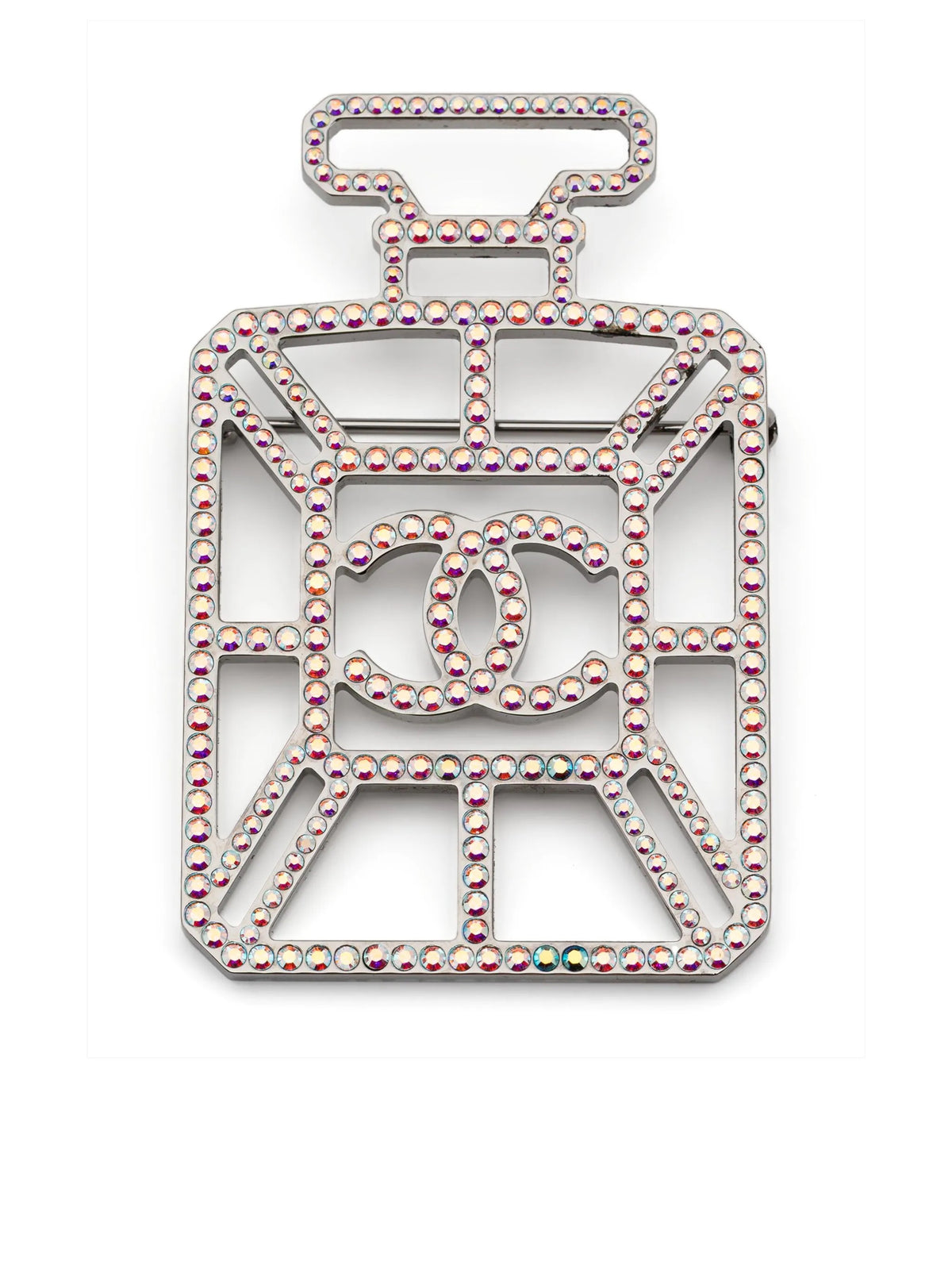 Iridescent Chanel perfume bottle brooch with CC logo, decorative jewelry accessory, shiny glass-like finish, detailed design.
