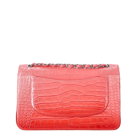 Chanel Jumbo Double Flap Bag in ombré red crocodile leather with silver-tone CC turn-lock closure, double flap silhouette, and interwoven chain-and-leather shoulder straps.
