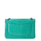 Chanel Jumbo Double Flap Bag in turquoise green exotic leather with silver-tone CC turn-lock closure, double flap silhouette, and interwoven chain-and-leather shoulder straps.
