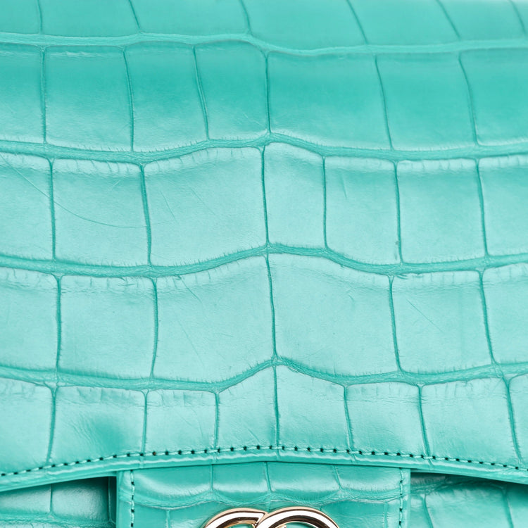 Chanel Jumbo Double Flap Bag in turquoise green exotic leather with silver-tone CC turn-lock closure, double flap silhouette, and interwoven chain-and-leather shoulder straps.