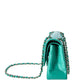 Chanel Jumbo Double Flap Bag in turquoise green exotic leather with silver-tone CC turn-lock closure, double flap silhouette, and interwoven chain-and-leather shoulder straps.