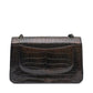 Back view of Chanel Jumbo Double Flap Shoulder Bag, showcasing its iconic quilted leather design and chain strap detail.