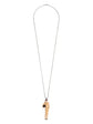 Chanel Keira Knightley doll pendant necklace with a gold chain and detailed doll charm, elegant jewelry accessory.