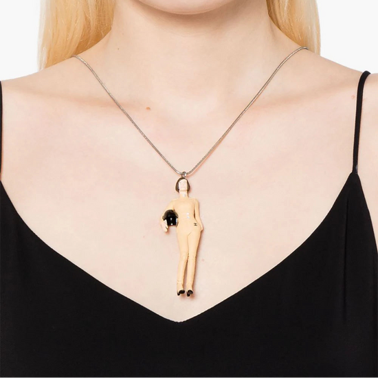 Chanel Keira Knightley doll pendant necklace featuring a detailed doll charm on a delicate chain.