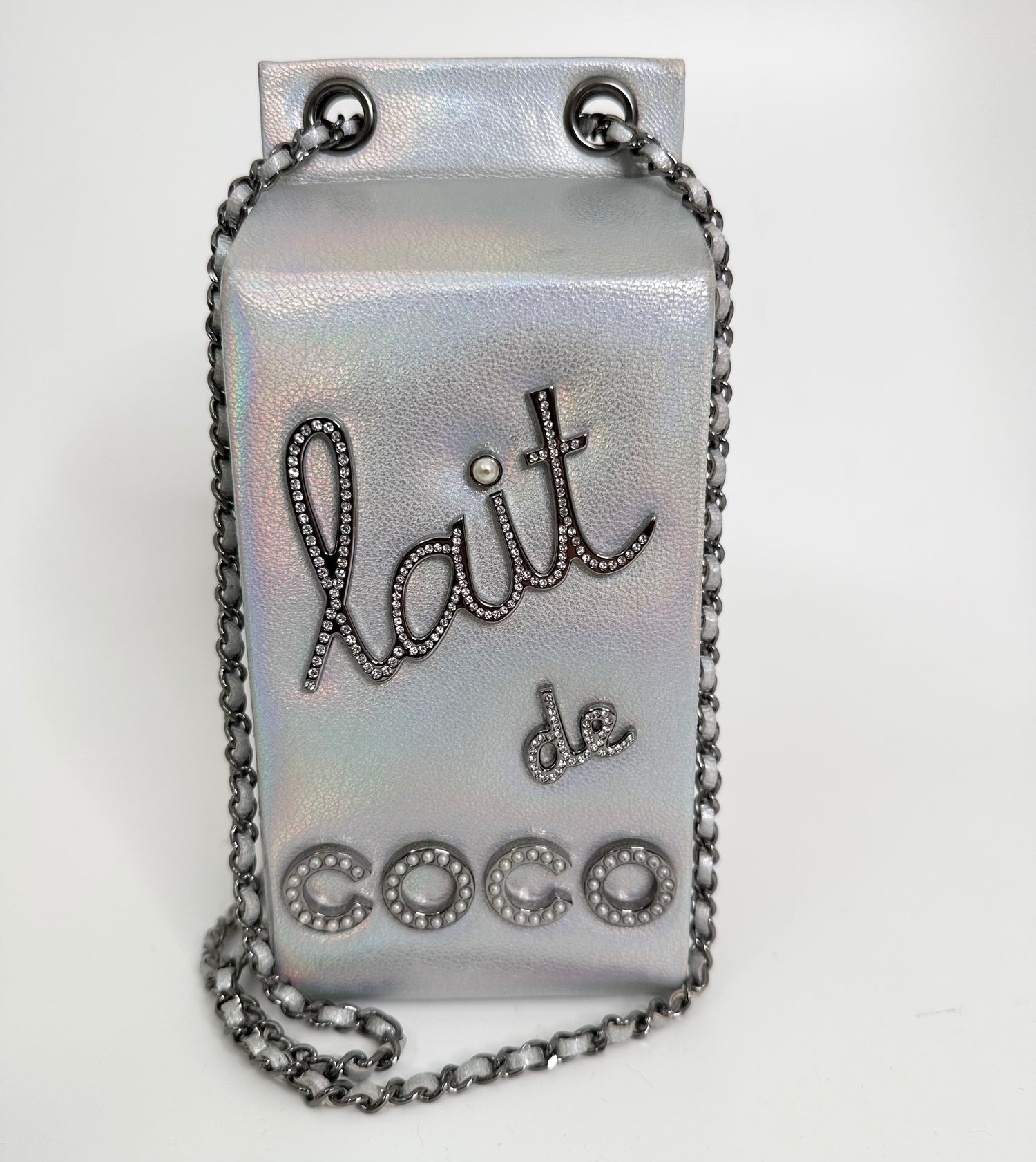 Close-up of quilted side panel on Chanel milk carton clutch