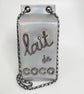 Close-up of quilted side panel on Chanel milk carton clutch