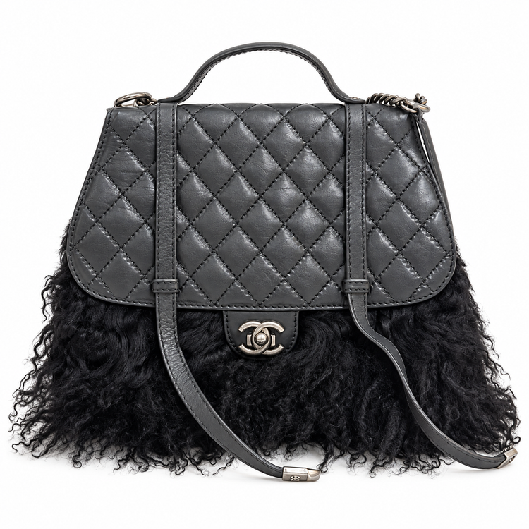 Chanel Paris-Dallas large quilted double flap handbag with fur accents, featuring signature Chanel design and elegant craftsmanship.