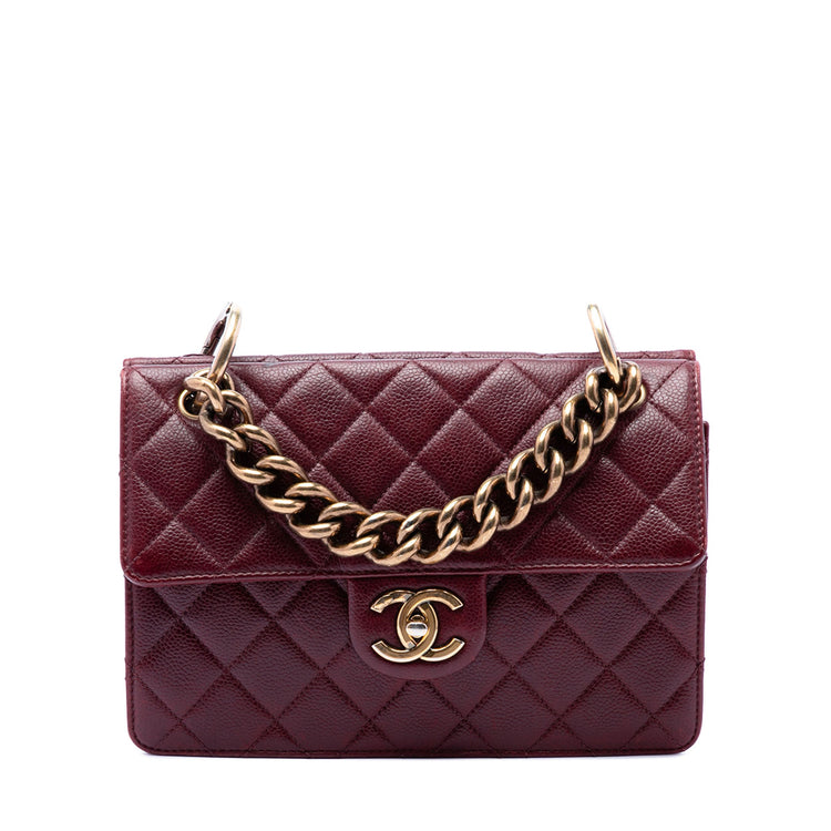 Chanel Paris-Edinburgh Caviar Flap Bag shoulder bag in black leather with gold hardware and quilted texture.
