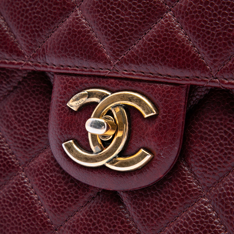 Chanel Paris-Edinburgh Caviar Flap Bag in black leather with gold chain strap and signature quilted design, shoulder bag style.