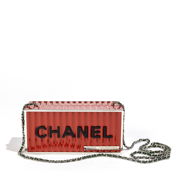 Chanel Paris Hamburg container minaudière clutch bag with sleek design, black finish, and elegant gold clasp on a white background.