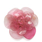 Pink Camellia brooch by Chanel featuring a delicate floral design and elegant craftsmanship.