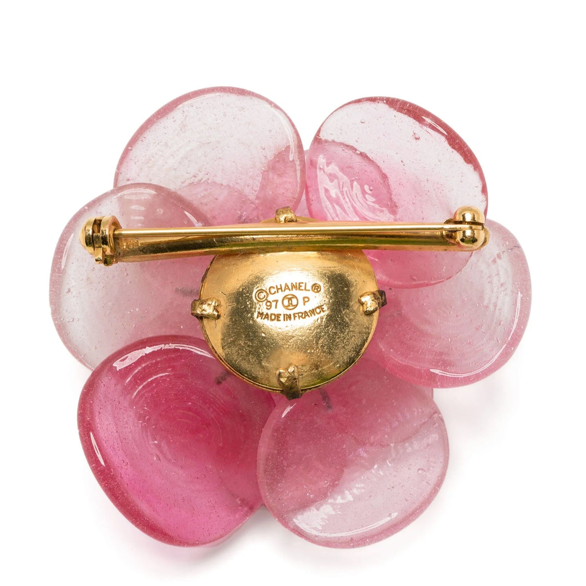 Pink Camellia Chanel brooch with delicate flower design, featuring pink petals and a subtle gold-tone pin back.