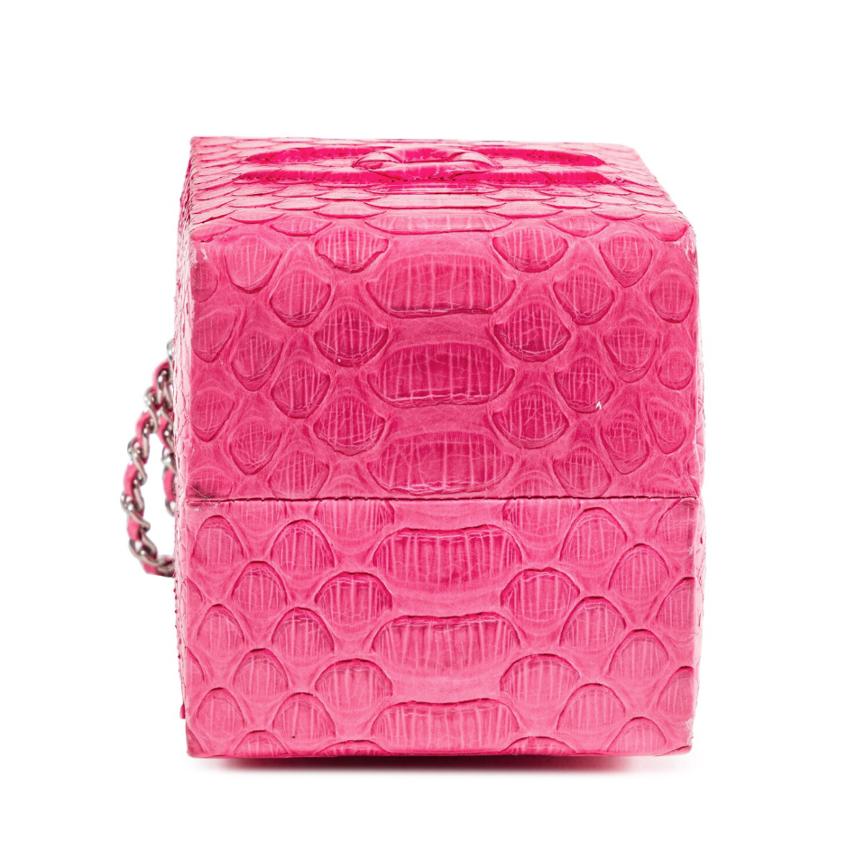 Chanel pink python leather clutch bag with milk carton design and Lait de Coco branding, stylish and unique accessory.