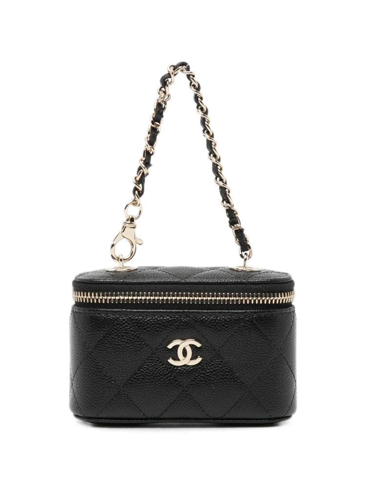 Chanel quilted caviar mini vanity bag charm with gold-tone hardware, featuring a compact, elegant accessory for handbags.
