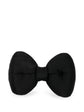 Chanel satin bow brooch featuring a sleek, elegant design with a shiny satin finish and classic bow shape.