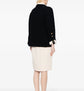 Chanel single-breasted bouclé skirt suit set featuring a tailored blazer and matching skirt, elegant and classic design.