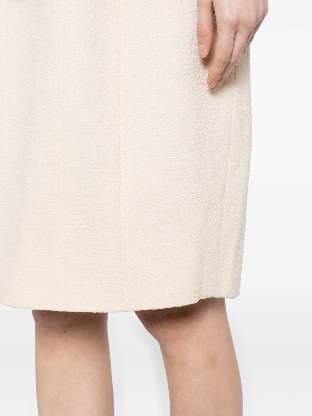 Chanel single-breasted bouclé skirt suit set with tailored blazer and matching skirt, elegant and classic fashion ensemble.