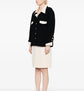 Chanel single-breasted bouclé skirt suit set featuring tailored blazer and matching skirt, elegant and classic luxury fashion.