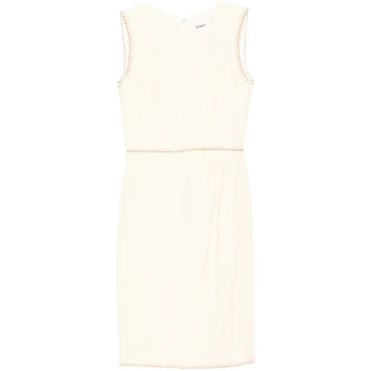 Chanel sleeveless cream wool tweed dress displayed on a hanger, showcasing classic elegant design and textured fabric.