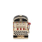 Chanel Slot Machine Casino Minaudière Clutch with black, cream and gold-tone slot machine design, CC logos, pearl-style top detail, rainbow crystal trim, checkerboard Chanel lettering, decorative lever and coin accents.