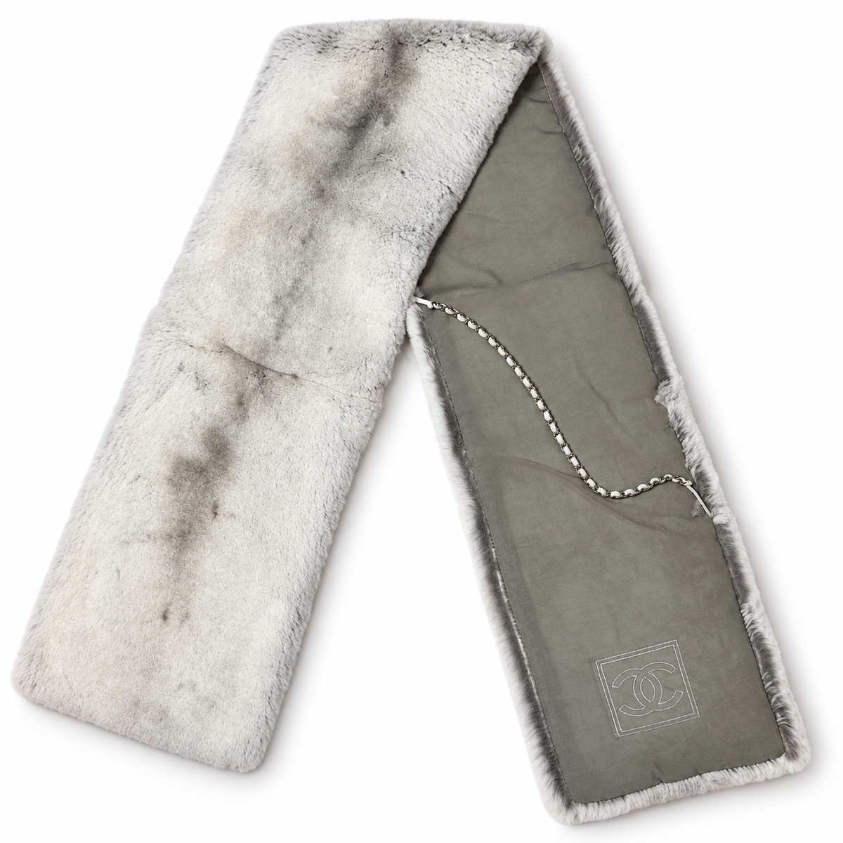 Chanel Sport Line fur scarf featuring luxurious Orylag fur, stylishly draped with the iconic Chanel branding visible.