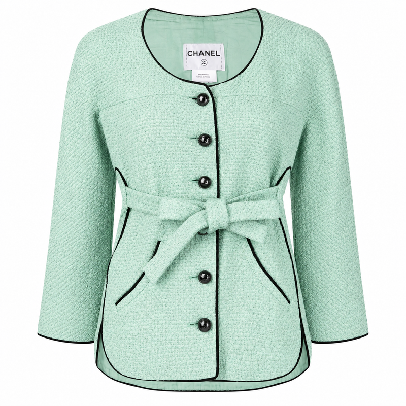 Mint green tweed Chanel jacket with belted waist, classic blazer style, and textured fabric from the 2012 spring collection.