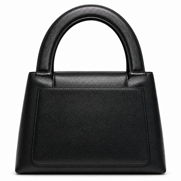 Chanel Vintage Kelly Bag from 1997–1999 in black caviar leather with 24K gold-plated CC hardware and structured double top handles.