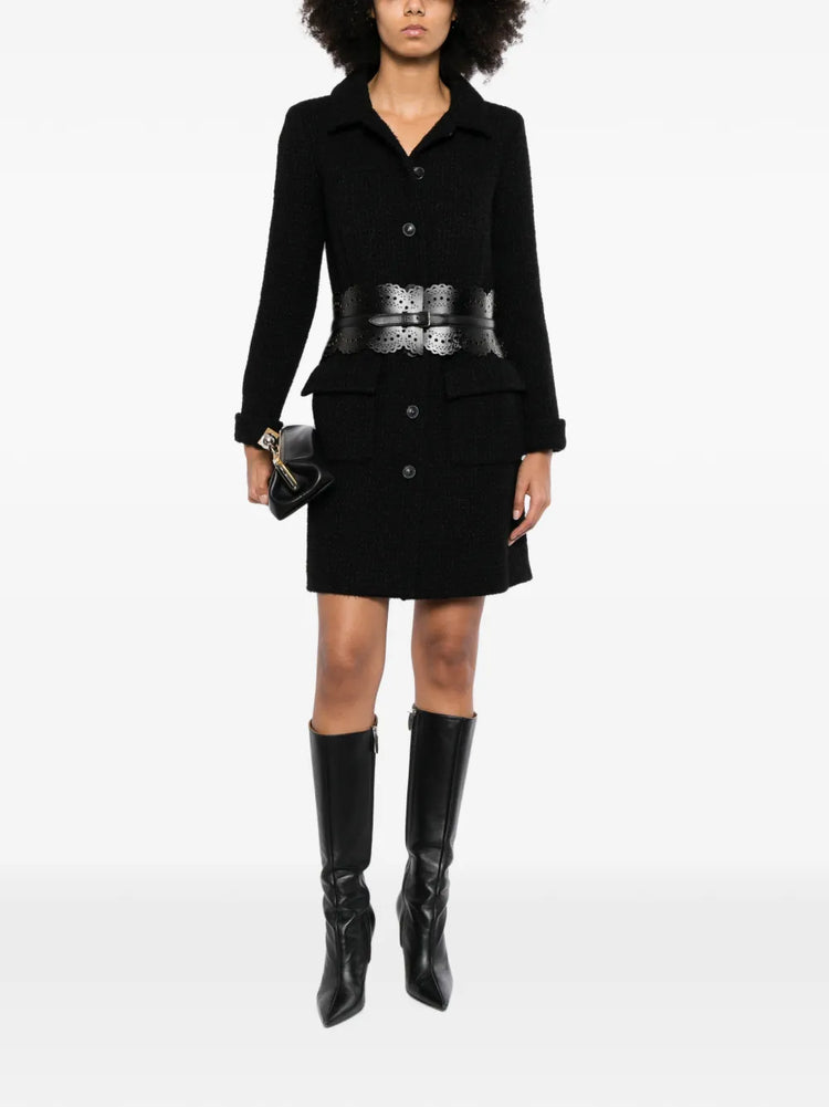 Chanel wool tweed coat with classic tailored fit, featuring a textured pattern and elegant design, perfect for sophisticated winter style.