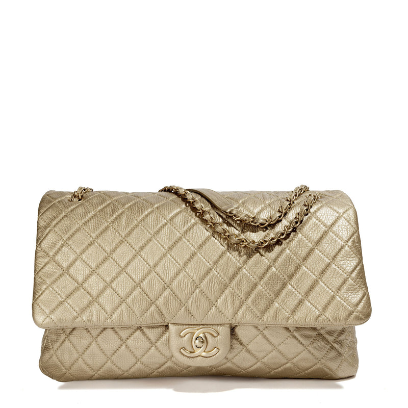 Metallic gold Chanel XXL airline travel flap bag with shoulder strap, stylish and spacious travel accessory.