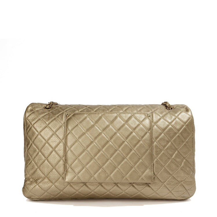 Metallic gold Chanel XXL airline travel flap bag with shoulder strap, showing the back view and sleek design.